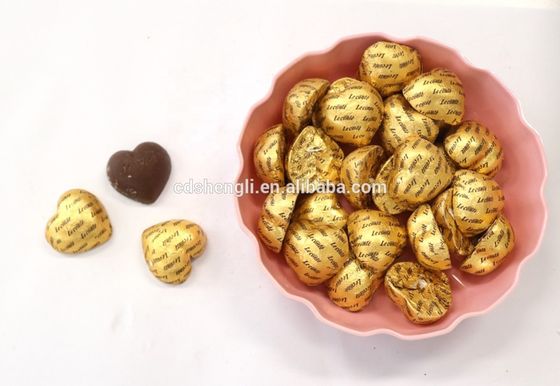 Máquina de embrulhar folhas de chocolate em forma de ovo em forma de bola redonda para material de embalagem de papel